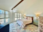 Queen bedroom offers windows with views of beautiful woods